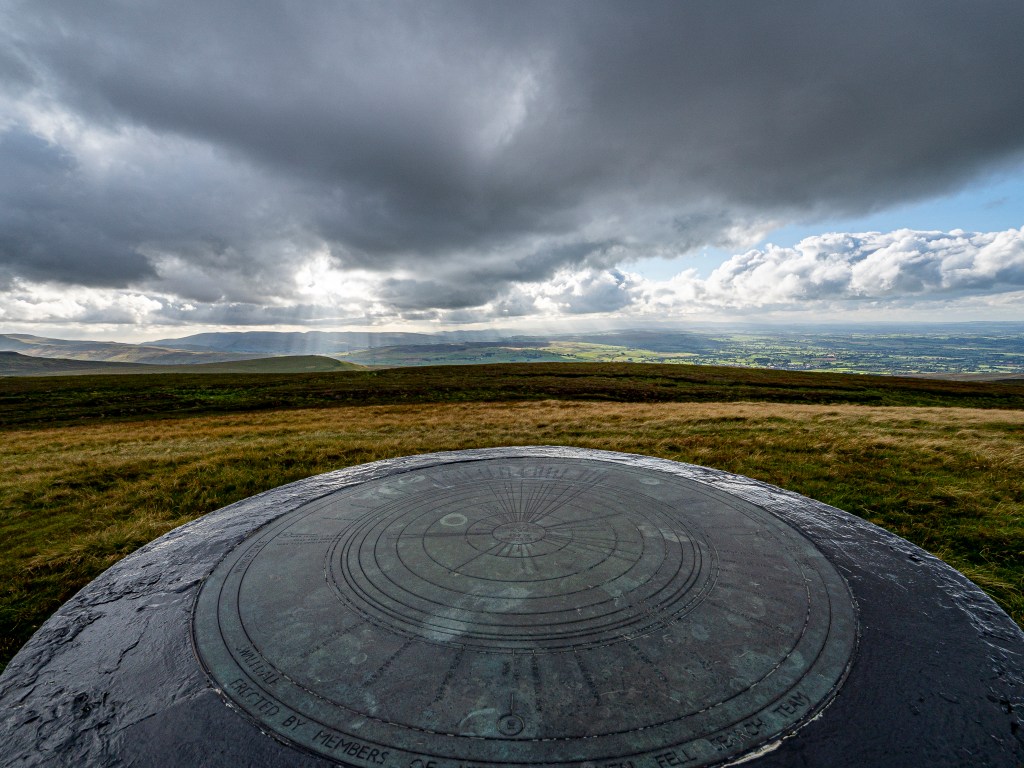 Viewpoint indicator between cairns and trig point of Nine Standards Rigg. Credit: Ian Battersby