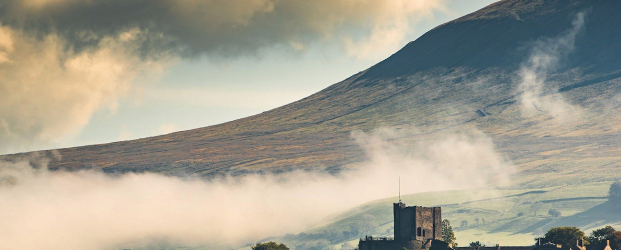 spooky walks - Brick fort below Pendle Hill, Lancashire with low clouds